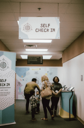 office indoor correx sign hanging from the ceiling